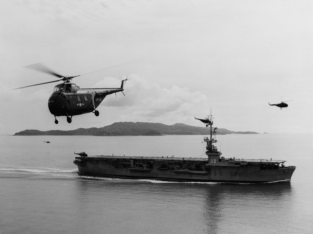 A US Navy Sikorsky HO4S flying near USS Sicily