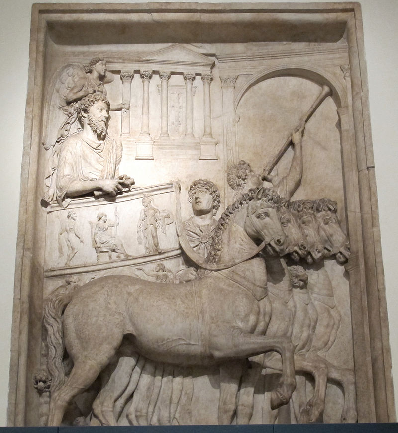 Marcus Aurelius celebrating his triumph over Rome's enemies in 176 AD, riding in a quadriga chariot