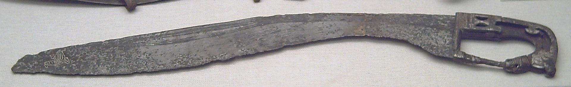 Iberian falcata, 4th/3rd century BC. This weapon, a scythe-shaped sword, was unique to Iberia. By its inherent weight distribution, it could deliver blows as powerful as an axe. National Archaeological Museum of Spain, Madrid