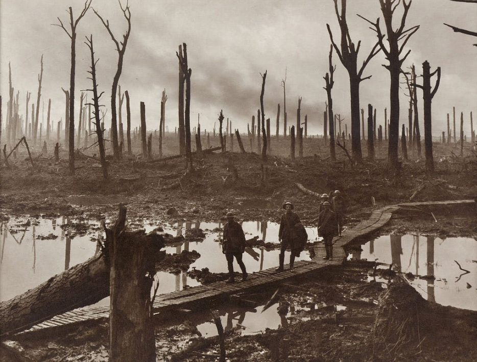 Australian gunners on a duckboard track in Château Wood near Hooge, 29 October 1917. Photo by Frank Hurley